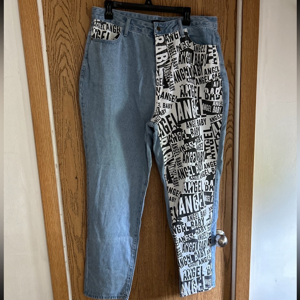 Nwt fashion nova jeans size 1X light blue with black and white writing on leg.